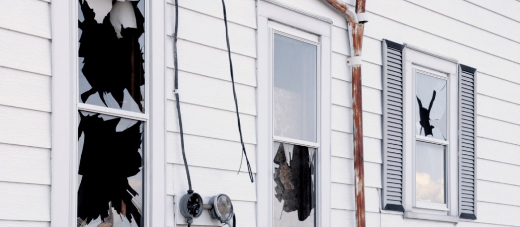 Damaged area inside a home shown in a guide to property damage and repairs.