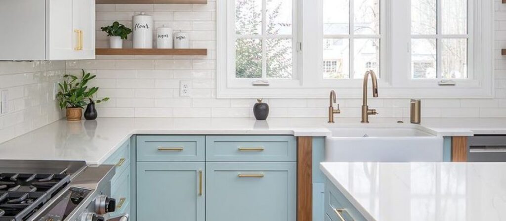 Residential kitchen interior shown in an article comparing help from a public adjuster and a lawyer.