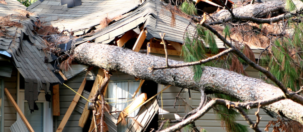 Damaged residential roof shown in a guide to home insurance coverage in California.