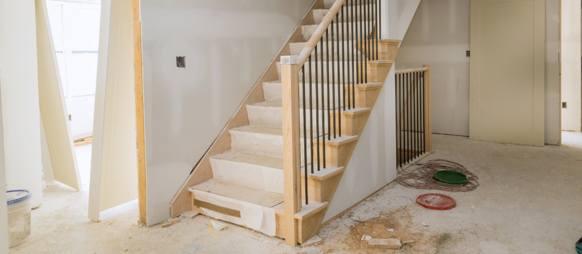 Residential staircase shown in a video about choosing a qualified restoration contractor.